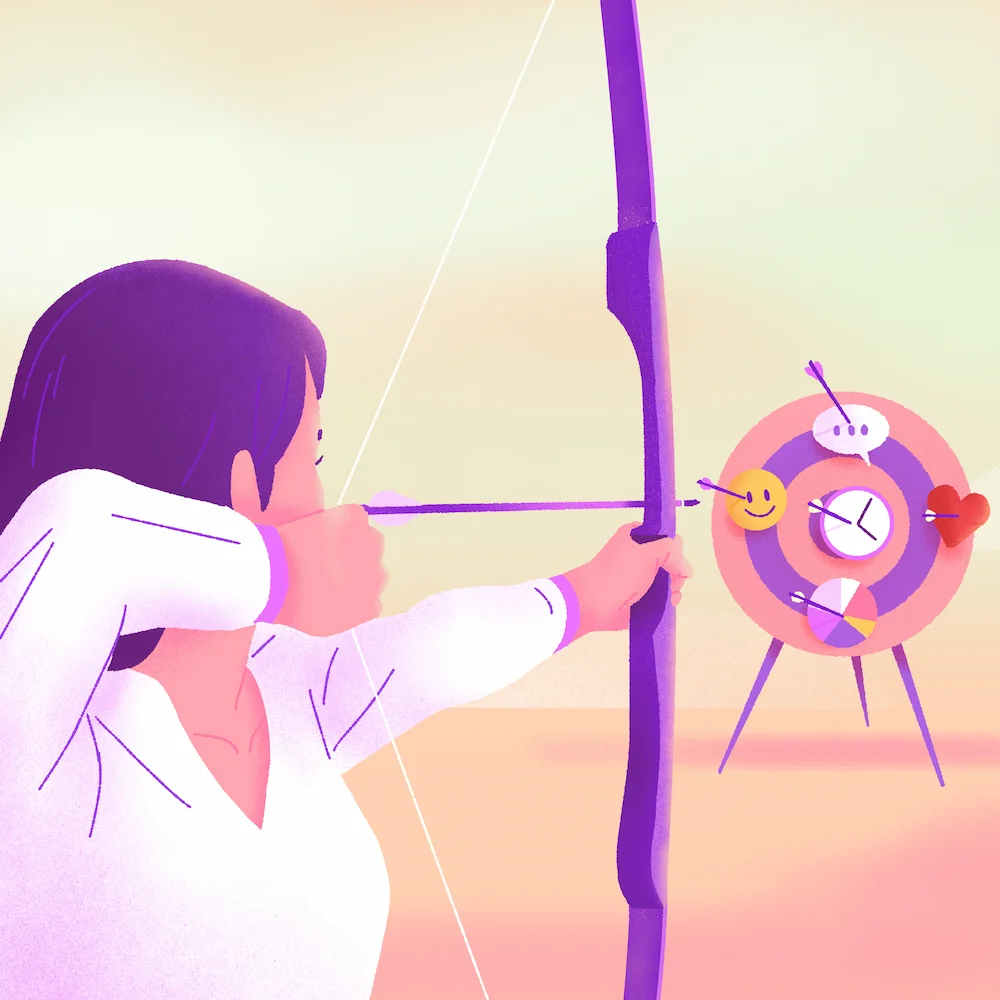 fille qui vise une cible avec un arc à flèches